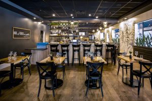 555 North bar area with two top tables